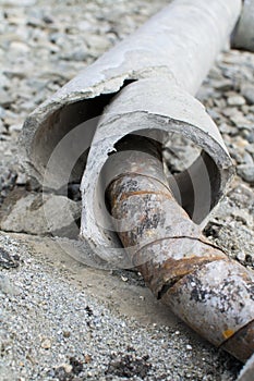Destroyed concrete pipe and rust close up