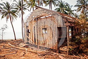 destroyed home at coast , wooden hut ruin / destroyed house