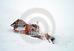 Destroyed house in avalanche photo