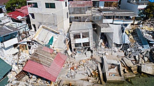 The destroyed house after the earthquake on the seashore