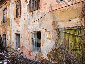 Destroyed house after a fire. Old brick building with Windows