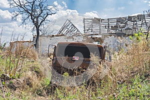 Destroyed military truck in the countryside