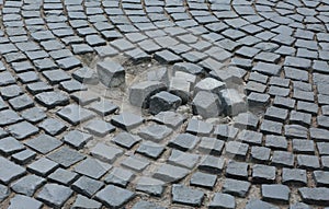 Destroyed part of the paving stone pavement