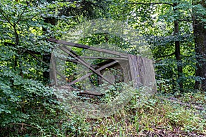 Destroyed raised hide for hunting in the middle of the forest