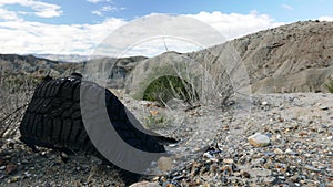 Destroyed rubber car tire on nature