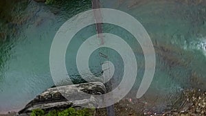 Destroyed suspension bridge over river in Carpathians