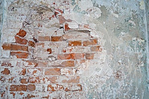 Destroyed wall in an ancient red brick building