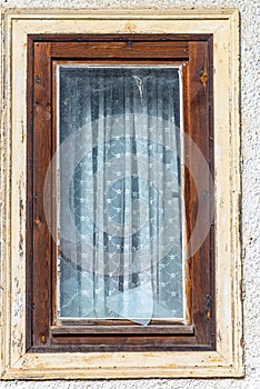Destroyed window pane in a wood window