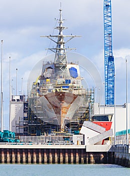 Destroyer under construction in a naval shipyard photo