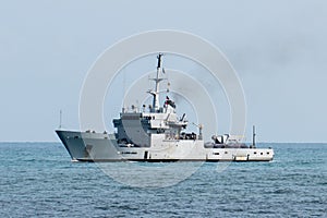 Destroyer war ship in action for migrants boat