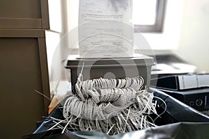 Destroying documents with Document shredder machine photo