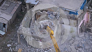 Destroying Old House Using Bucket Excavator on Construction Site.