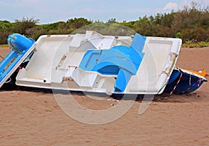 destroys boats on the sandy beach