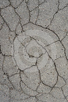 destructed tar road in a town