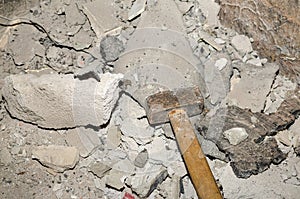 Destructed wall and hammer