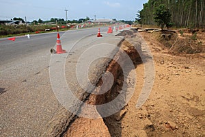 Destruction of asphalt highways road after hard rain storm and f