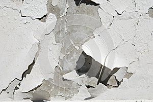 Destruction of plaster on concrete wall