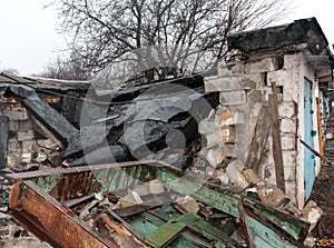 Destruction from shelling in the Donbas. Broken garage photo