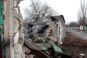 Destruction from shelling in the Donbas. Broken garage photo