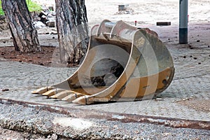 Detached bucket of the escort lying on the ground