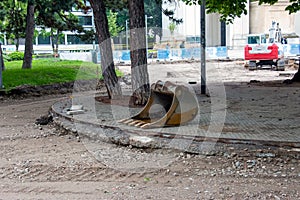 Detached bucket of the escort lying on the ground