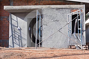 Detached house of brick in massive construction site