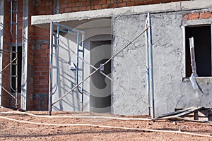 Detached house of brick in massive construction site