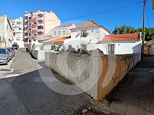 Detached house in Lisbon in traditional video and multi-storey modern houses in the background