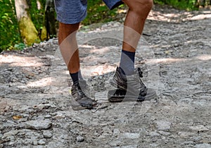 detached sole on the tourist's sneakers. They broke their boots in the woods