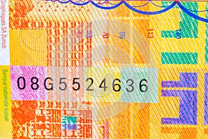 Detail of 10 CHF Swiss franc banknote with serial number on banknote