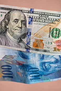 Detail of 100 USD banknotes next to 100 CHF banknotes. Detail of United States Dollar and Swiss Franc. World money concept,