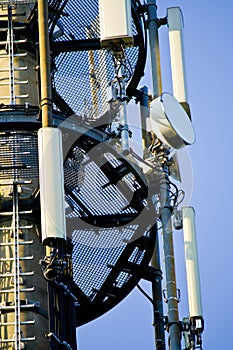 Detail of a 3G, 4G LTE transmitter tower against clear blue sky