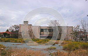 Detail of an abandoned building in cloudy landscape