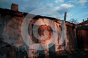 Detail of an abandoned building in cloudy landscape