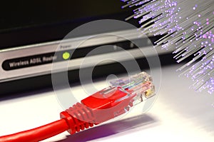 Detail of ADSL modem router with luminescent fiber optic lights and lan cable rj45