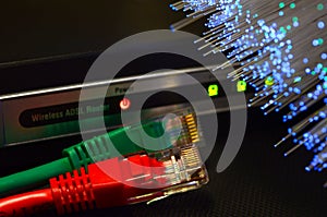 Detail of ADSL modem router with luminescent fiber optic lights and lan cable rj45