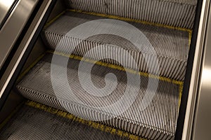 Detail aluminium metal riser and tread of escalator.