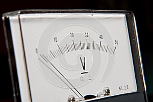 Detail of an analog voltmeter, pointer scale