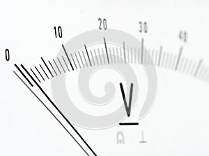 Detail of an analog voltmeter, pointer scale