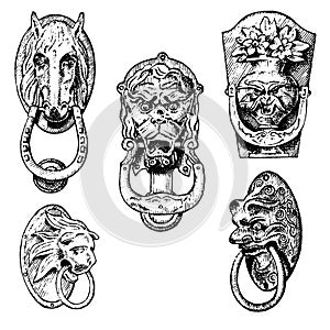 Detail ancient building. architectural ornamental elements, wooden door knob, knocker or handles. lion and horse