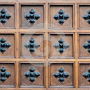 Detail of an ancient door built in wood and iron