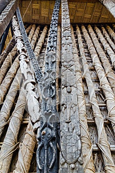 Detail of animal wood carvings on pillars at traditional Fon`s palace in Bafut, Cameroon, Africa photo