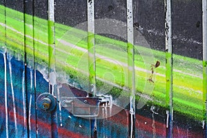 Detail of an anonymous street graffiti with many colors, cheerful urban background