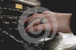 Woman hands writing with an old typewriter