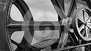 Detail of antique elevator metal gear wheel black and white