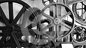 Detail of antique elevator metal gear wheel black and white
