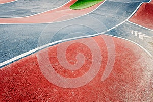 Detail of the asphalt and the white lines of a pumptrack circuit