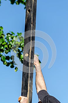 Detail of an athlete hanging from an obstacle at an obstacle course race, OCR. Extreme sports competition photo