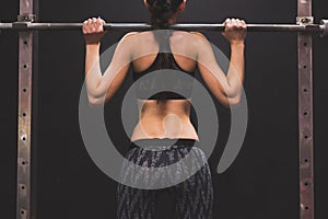 Detail of an athletic girl doing workout in the gym