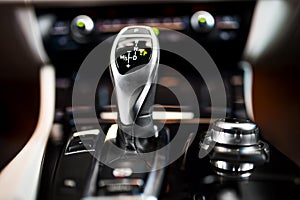 Detail of an automatic gear stick in a new, modern car